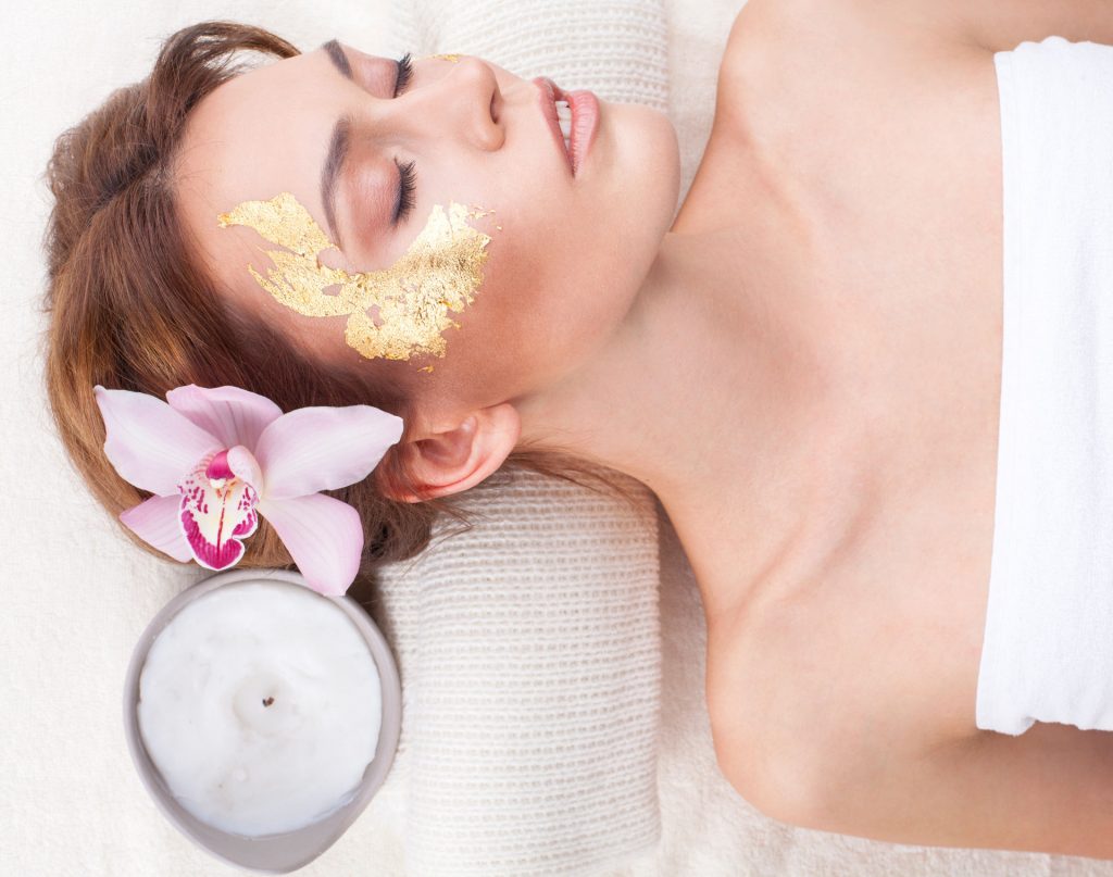 24K Gold Bar Soap by CleAurum Woman in Spa with Gold Collagen Eye Mask