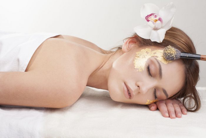 Luxury relaxation with gold leaf facial mask.